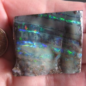 Boulder Opal -Parallel Gem stripes Golds, Reds, Greens, & Blues Very Bright 1.25” x 1.2” x .25” thick .645oz IMG8694