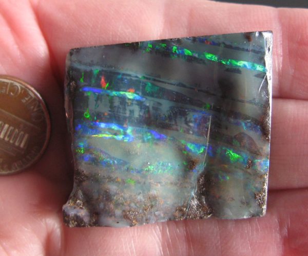 Boulder Opal -Parallel Gem stripes Golds, Reds, Greens, & Blues Very Bright 1.25” x 1.2” x .25” thick .645oz IMG8694