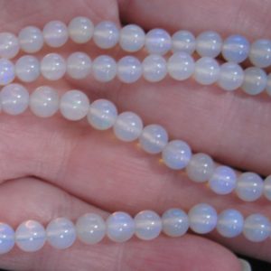 $300 IMG0806 - Andamooka Blues 5mm Round 57cts