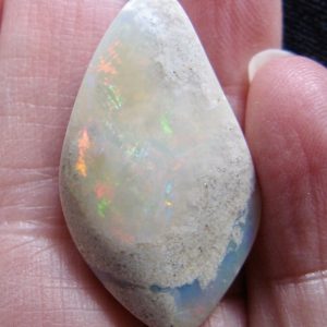 Mintubi on Sandstone Bright Reds and Green Flash $8/ct 21.7cts